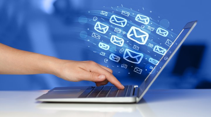hand on keyboard laptop mail envelopes email marketing